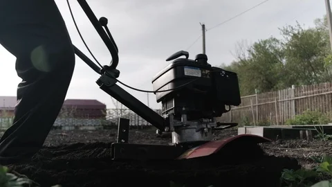 Old man plowman plows the earth with a big effort motoblock. Very hard work. 4k 스톡 동영상 130015131