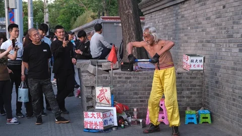 Old man practises Chinese martial arts on the street Stock Footage 109042316