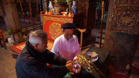 Old man preparing worship offerings on altar Stock Footage 87469100