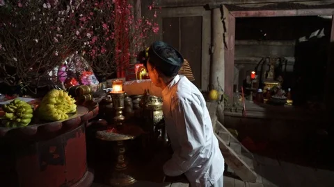 Old man preparing worship offerings on altar Stock Footage 87488000