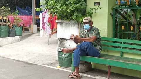 The old man put on a rolex watch and then left his seat Stock Footage 162352165