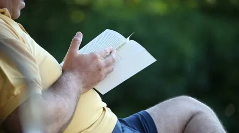 Old man readind at park Stock Footage 11134893