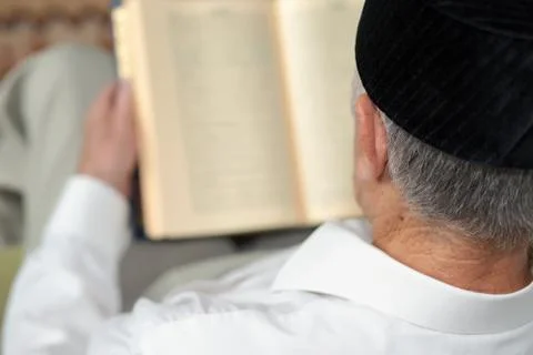 An old man reading the book. Selective focus Фото