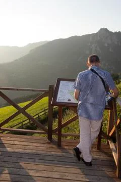 Old man reading map on viewpoint Stock Photos