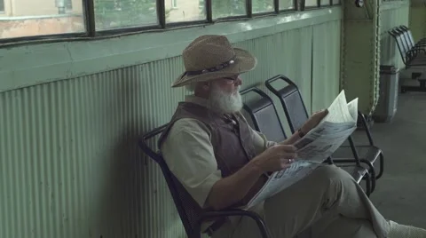 Old Man Reading A Newspaper Stock Footage 64146351