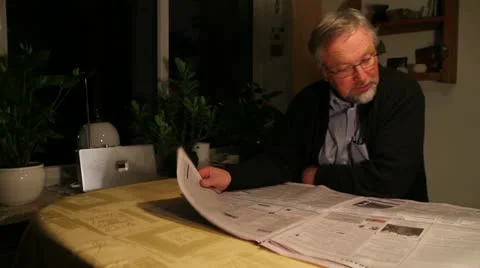 Old man reading newspaper - HD Stock Footage 22085492