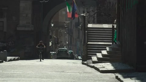 Old man rides a bicycle through the city center of Catania，Sicily Stock Footage 168240838