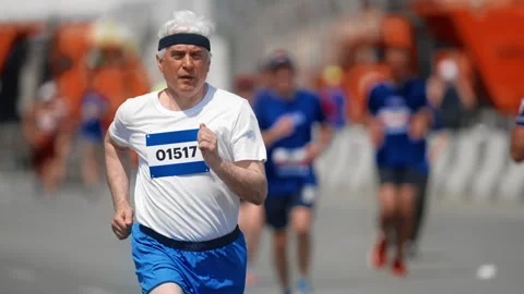 Old man run marathon. Senior sportsman jog outdoor. Elder runner. Motivation. Stock Footage 308162285