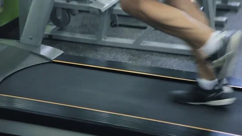 Old man runs on a treadmill Stock Footage 71638048
