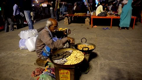 Old man selling peanuts Stock Footage 103413675