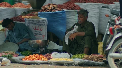 Old man selling Vegetable 動画素材 232700776