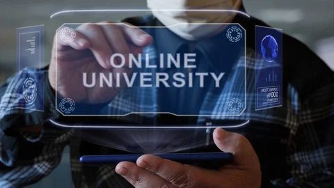 Old man shows hologram with text Online university Stock Footage 128933973