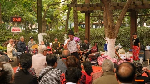 Old man singing for audience in park, China. Stock Footage 112259327