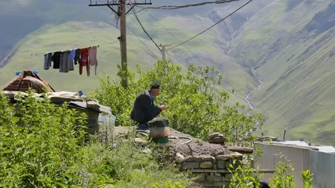 An old man sit and looking to the mountains Stock Footage 249170227