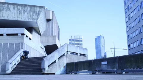 Old man sits down alone of the steps of a grey building in London Stock-Footage 107617042
