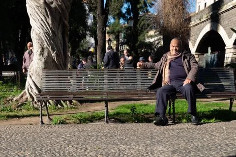 Old Man Sitting on Bench Stock Photos
