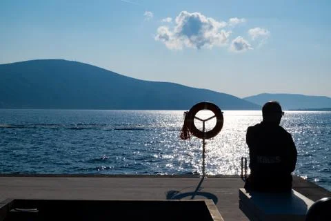 Old Man Sitting in the Dock Stockfoto's