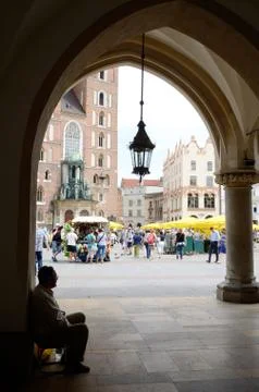 Old man sitting inside renaissance sukiennice,medieval trade area,krakow, poland Stock Photos