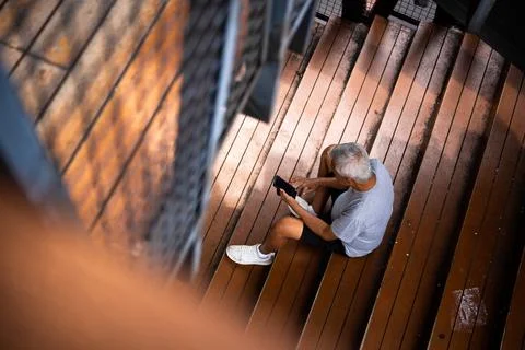 Old man sitting Stock Photos