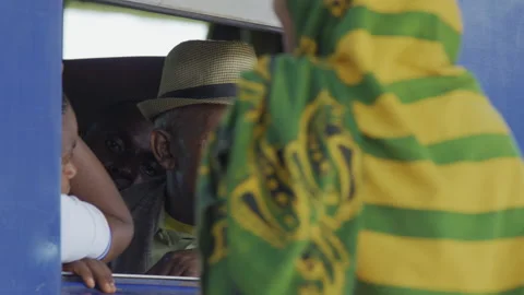 Old man sitting by the window on the train In A Station.DaresSalaam Tanzania Stock-Footage 131828441