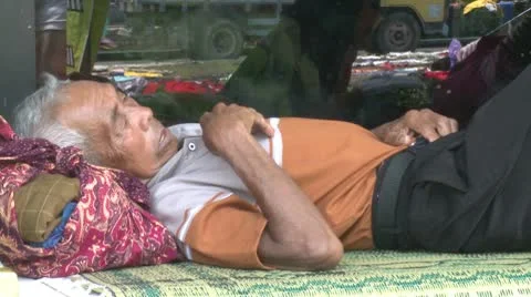 Old Man Sleeps In Refugee Camp During Merapi Volcano Eruption Stock Footage 8980691