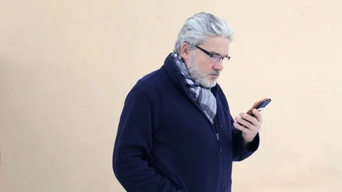 Old man smiles at camera Stock Footage 71729649