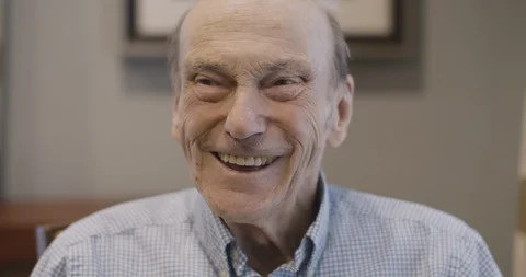 Old Man Smiling And Laughing into camera Stock Footage