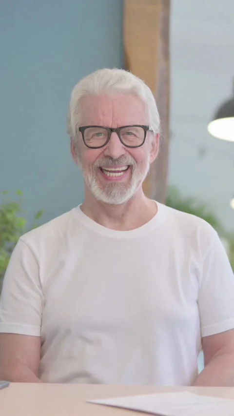 Old Man Smiling at Camera at Work, vertical video Video stock 329106648