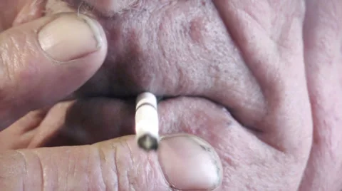 Old man smoking cigarette. Close up Stock Footage 35167771