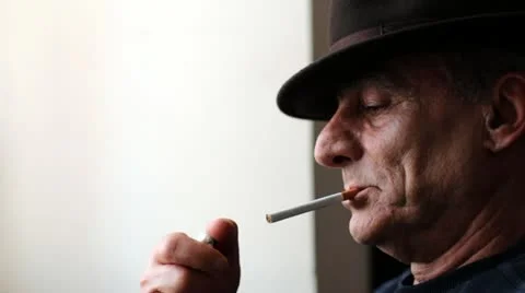 Old man smoking a cigarette Stock Footage 21425006