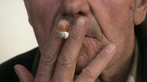 Old man smoking cigarette Stock Footage 36560540