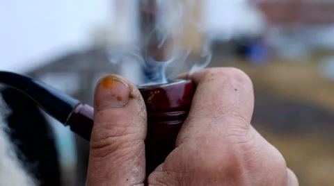 The old man smoking a pipe Stock Footage 61609739