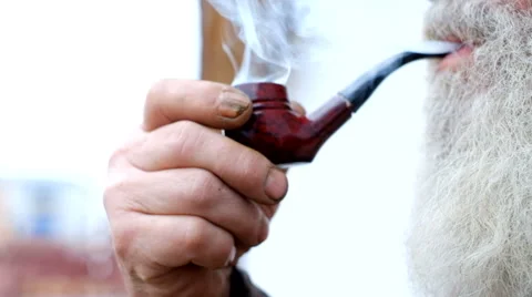 The old man smoking a pipe Stock Footage 61609904