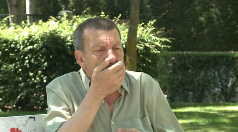 Old man sneezing Stock Footage 33800950