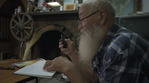 The old man speaks on the phone Video stock 66299738