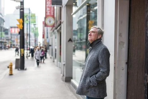 Old man standing alone Stock Photos