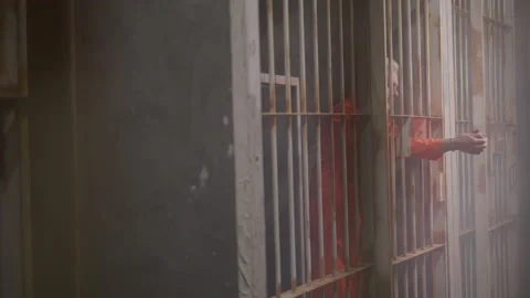 Old Man Stands at the Doors of His Jail | Stock Video | Pond5