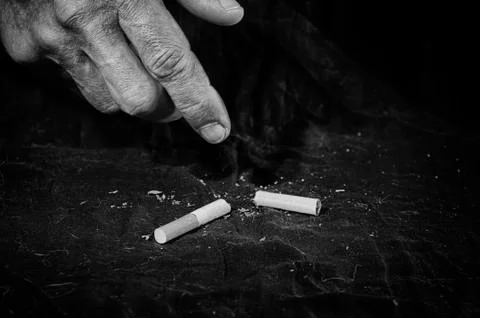 The old man stops smoking. Stock Photos