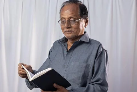 Old man studying Stock Photos