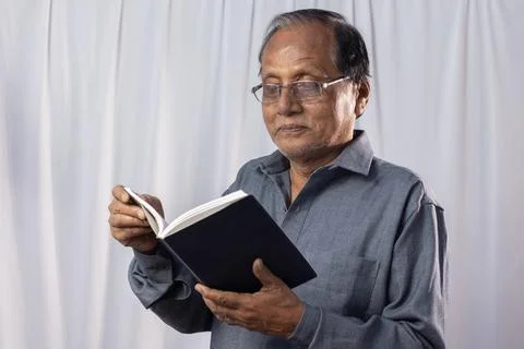 Old man studying Stock Photos