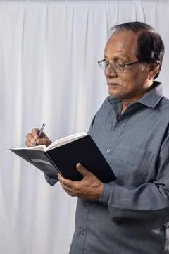 Old man studying Stock Photos