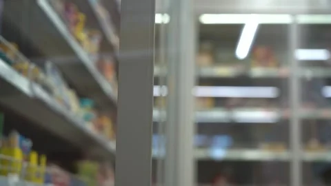 Old Man in Supermarket. A Shopper Opens the Refrigerator in the Store. Elderly Video stock 152557724