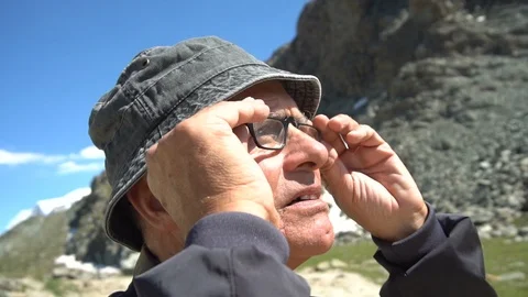 Old Man Taking off Glasses While and Looks Amazed - Slow Motion - Model Released Stock Footage 93345878