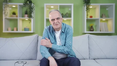 The old man is talking looking at the camera. Stock Footage 237795860