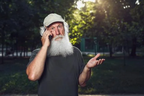 Old man talking on the phone Stock Photos