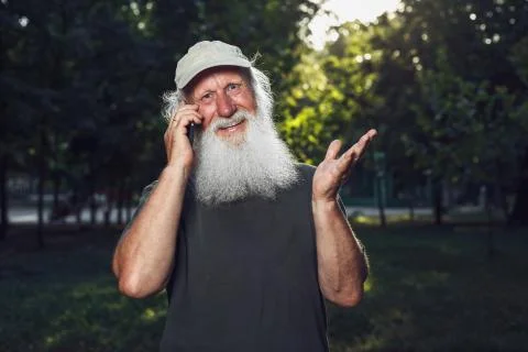 Old man talking on the phone Stock Photos