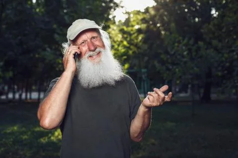 Old man talking on the phone Stock Photos