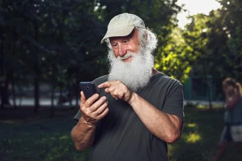 Old man talking on the phone Stock Photos