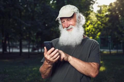 Old man talking on the phone Stock Photos