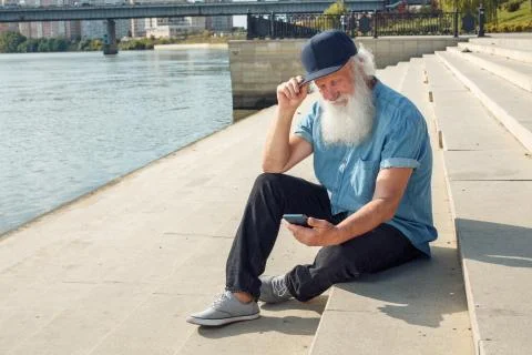 Old man talking on the phone Stock Photos